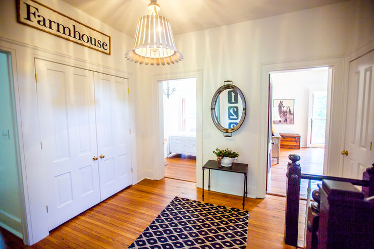 The elegant 2nd floor hallway leads to four exquisitely designed bedrooms and suites, showcasing a blend of style and comfort.