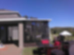 Screened lanai with patio furniture, close view of the screen panels — Jeremy's Screen Repair & Handyman Service