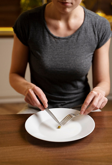 woman-with-eating-disorder-having-pea-her-plate_23-2149229145.jpeg