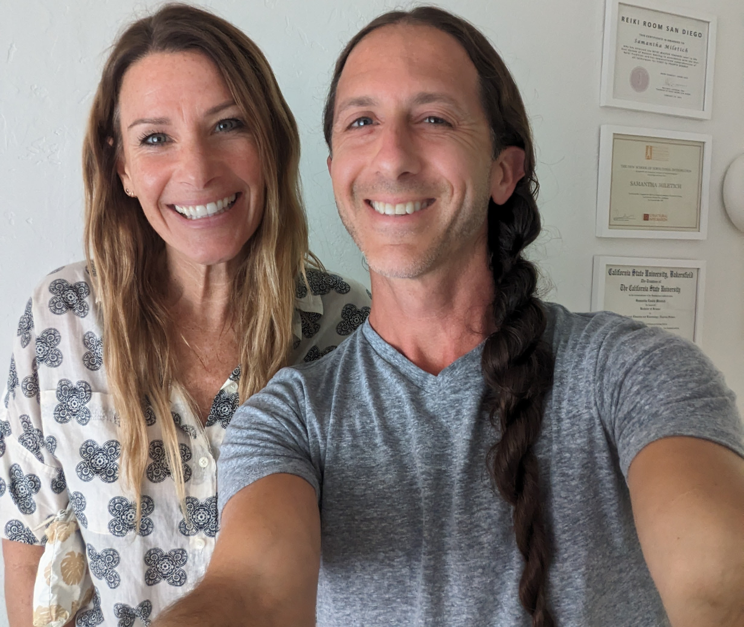Brian smiling with a client during a hypnotherapy session.