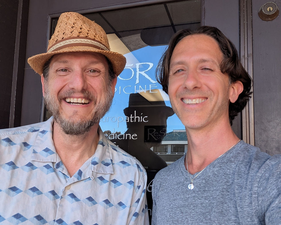 Brian smiling with a client during a hypnotherapy session.