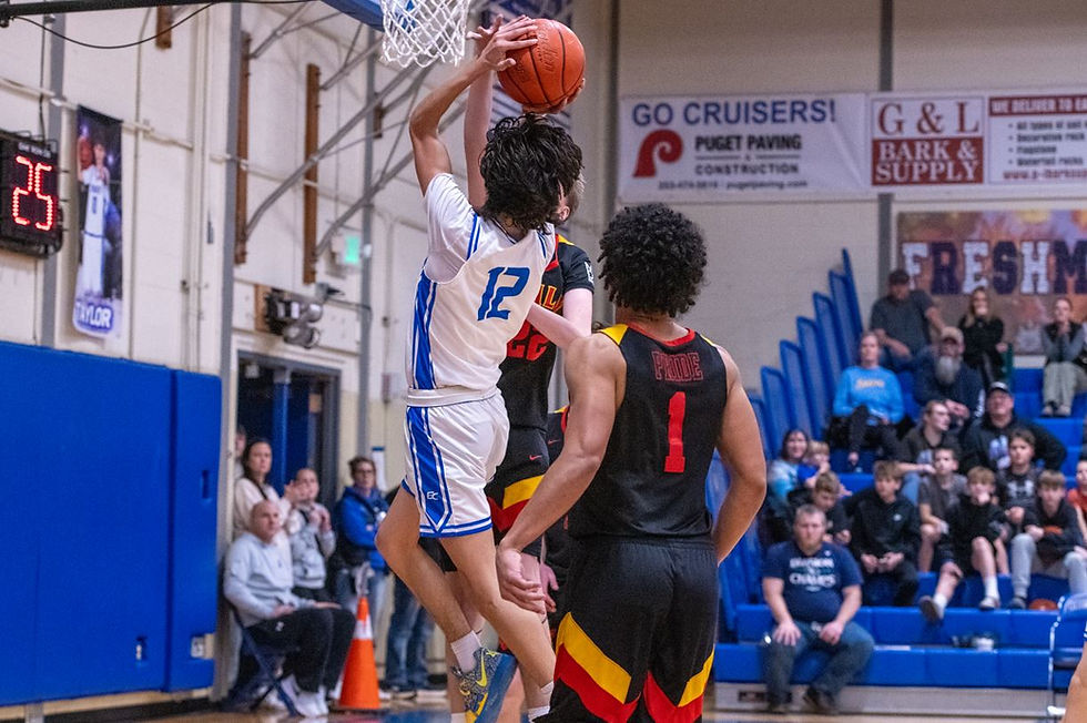 Eatonville’s Sam Twedt rises above the defense for a mid-range jumper during league action, part of a career-high 18 point performance for the Cruiser guard. Photo: Heather Quirie