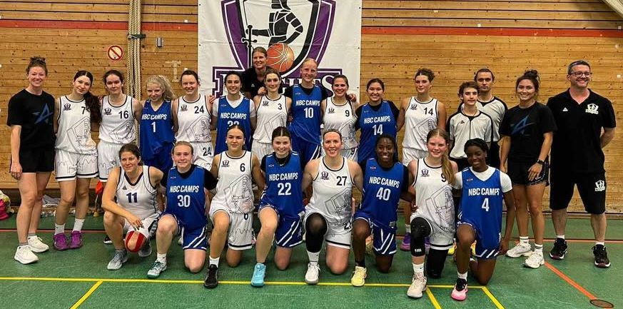 Eatonville High School senior Miley King poses with her NBC travel team along with one of the teams they competed against in Germany. Photo: David King