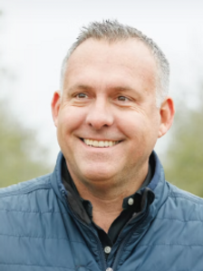 Headshot of Adam Gray.