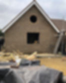 large bungalow extension built using west hovely bricks with feature round window