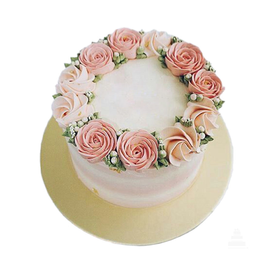 Pastel Día de las Madres de un nivel con acabado buttercream suave, coronado con una guirnalda de rosas en tonos nude y blush