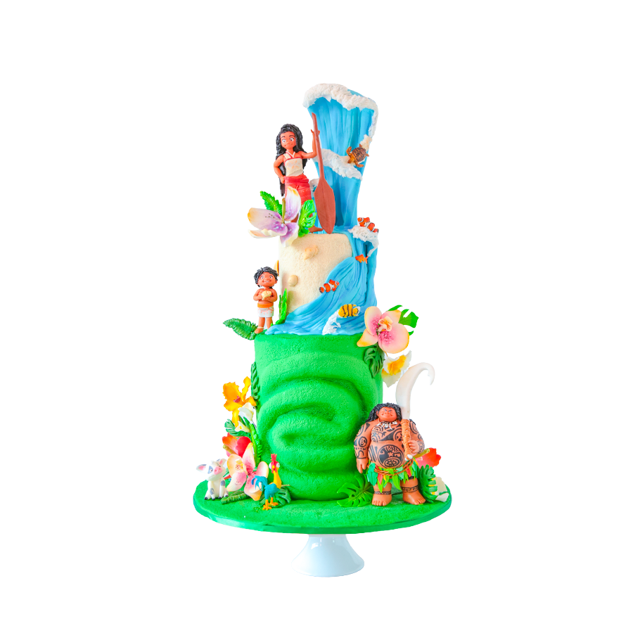 Pastel de cumpleaños de Moana, de tres niveles con acabados texturizados que recrean la isla, el océano y las olas.