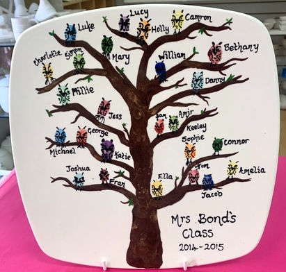 Collective teacher gift plate from whole class, there are fingerprints from each student that have been turned into owls, then the plate has been decorated with a tree.