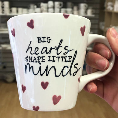 Big hearts shape little minds mug painted by staff at Crafty Monkey