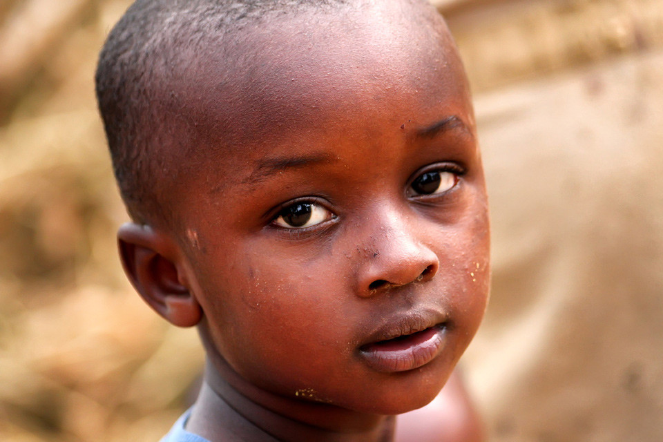 Little boy looking at the camera with a gentle but serious expression