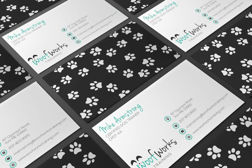 Business card mockup for Woof Works Dog Training featuring paw print designs and contact details for certified dog trainer Mike Armstrong.