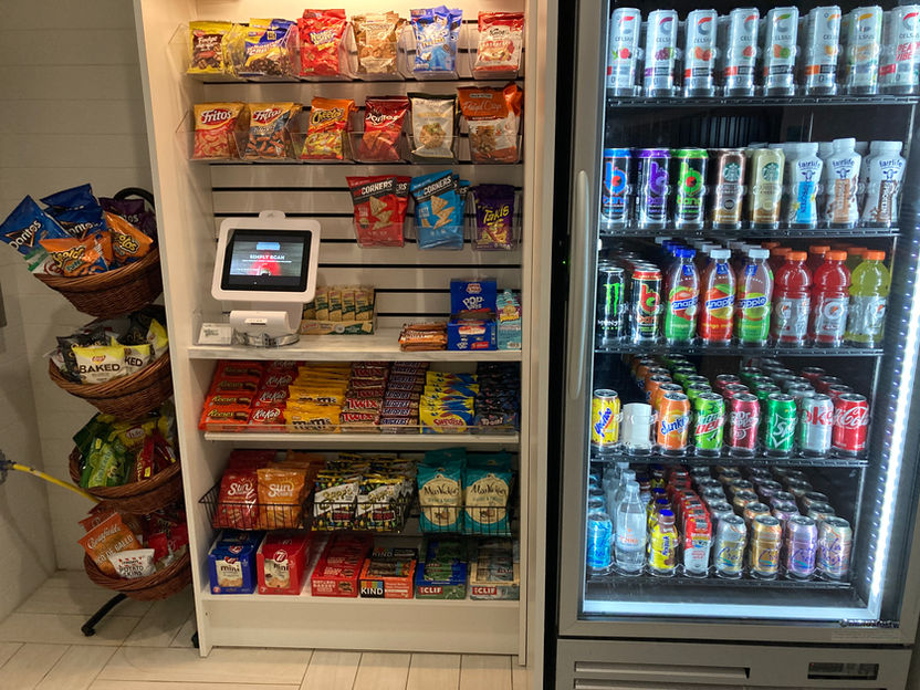 Self-checkout micro market kiosk inside a modern South Florida office breakroom