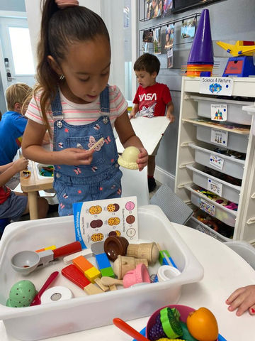 preschooler playing with toys at preschool in lighthouse point