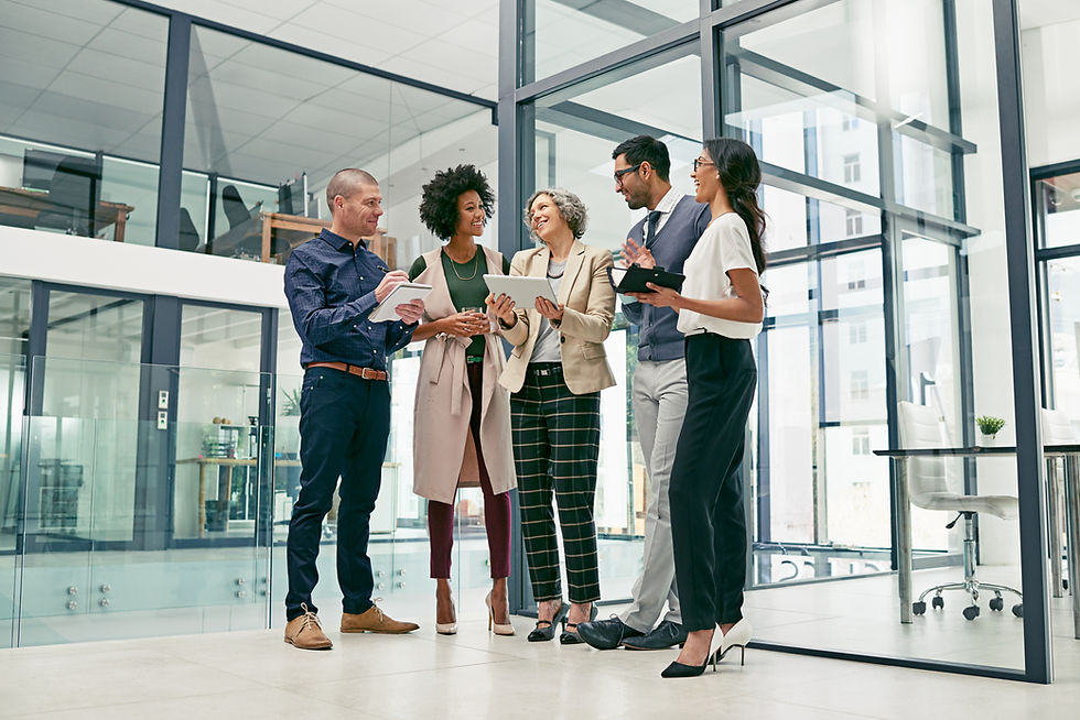 Diverse healthcare and administrative professionals collaborating together in a modern office environment at a Community Health Center organization.