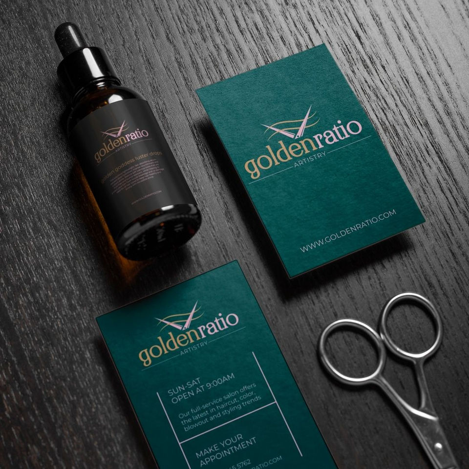 Golden Ratio serum bottle and business cards on wood surface.