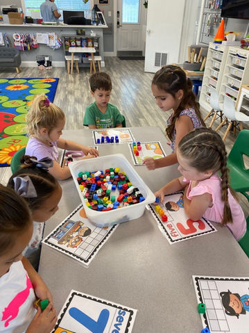 children sitting together at school in lighthouse point