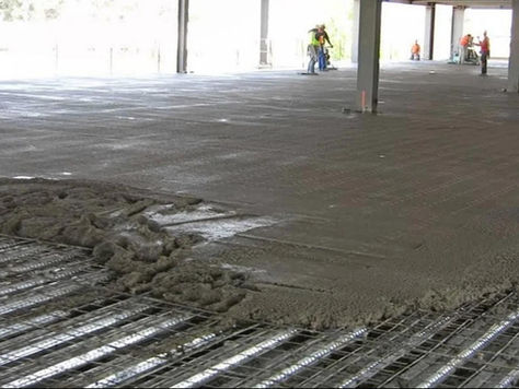 macro fibers reinforcing composite metal deck slab during concrete placement