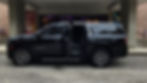 Best luxury transportation Orlando can offer. Sleek black SUV parked in front of luxurious hotel ent