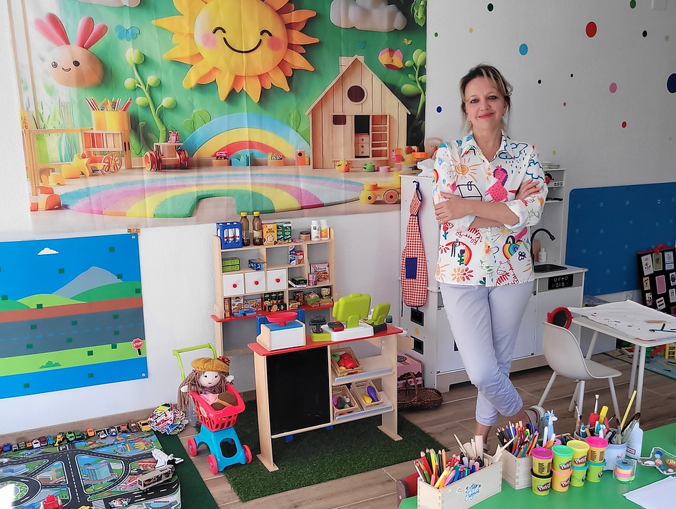 Teacher in an early childhood development center playroom.