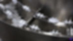 Miniatura: Bowl feeder personalizado en acción alimentando piezas en línea de producción automatizada.