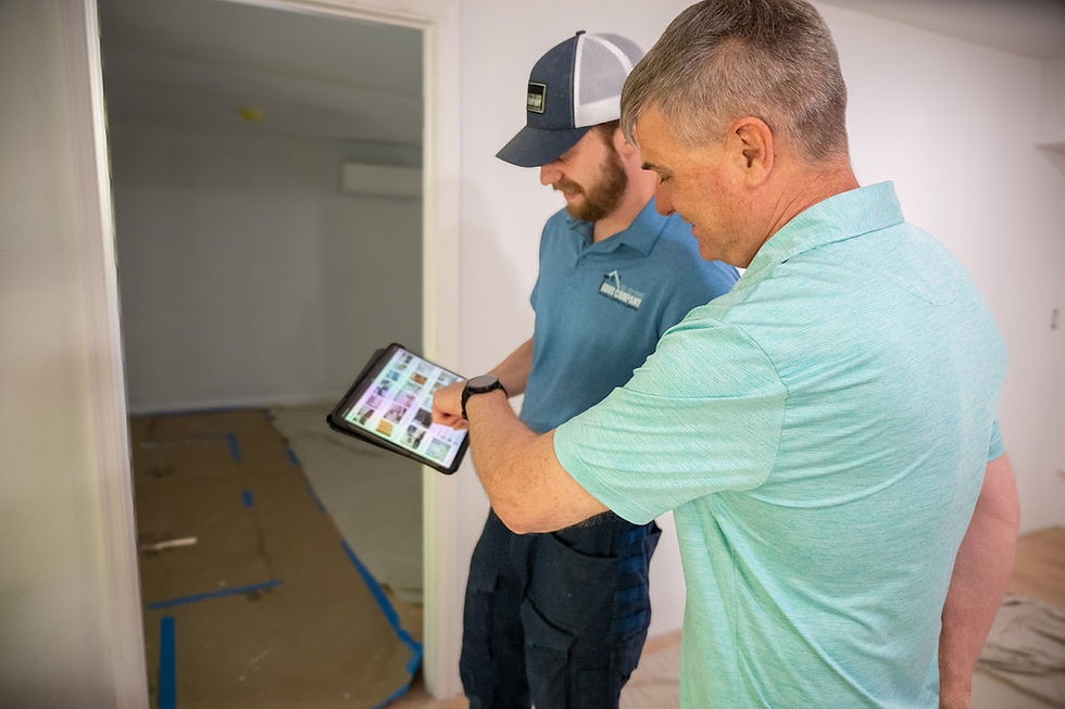 Two men looking at an ipad