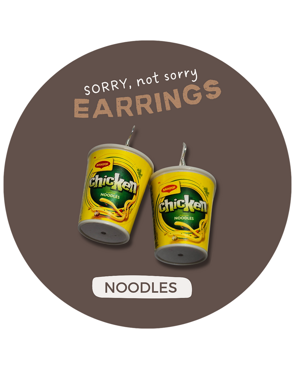 Pair of earrings with cup of instant noodles