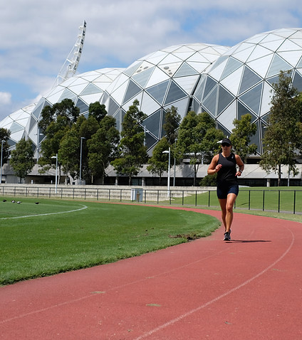 Physio running on a track