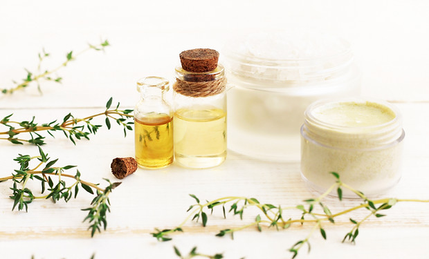 Thyme essential oil. Glass bottles with