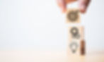 vecteezy_hand-putting-target-board-which-printing-on-wooden-cube_7126276.jpg