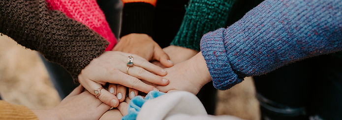 girl friends hands piled togethger_edited.jpg