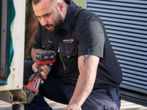Tony working on an air conditioning unit