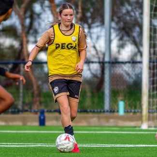 Academy female soccer player in soccer training