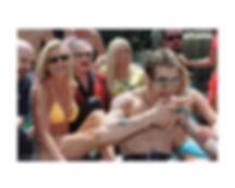 Godsmack, Hugh Hefner, and Playboy bunnies laughing poolside at the Playboy Mansion