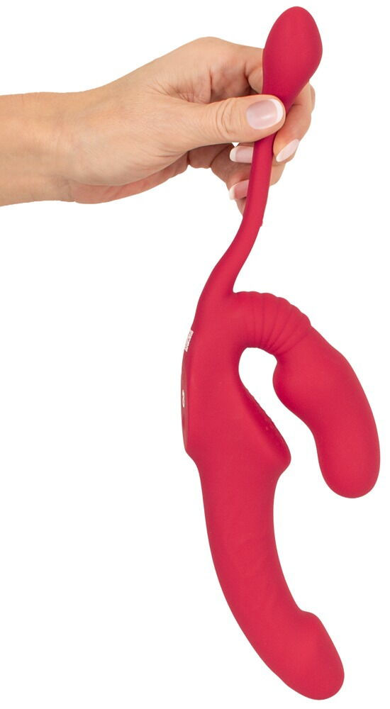 Thumbnail: Roter Strapless Strapon Vibrator Triple Teaser RC. Frauenhand demonstriert Flexibilität des Analplugs