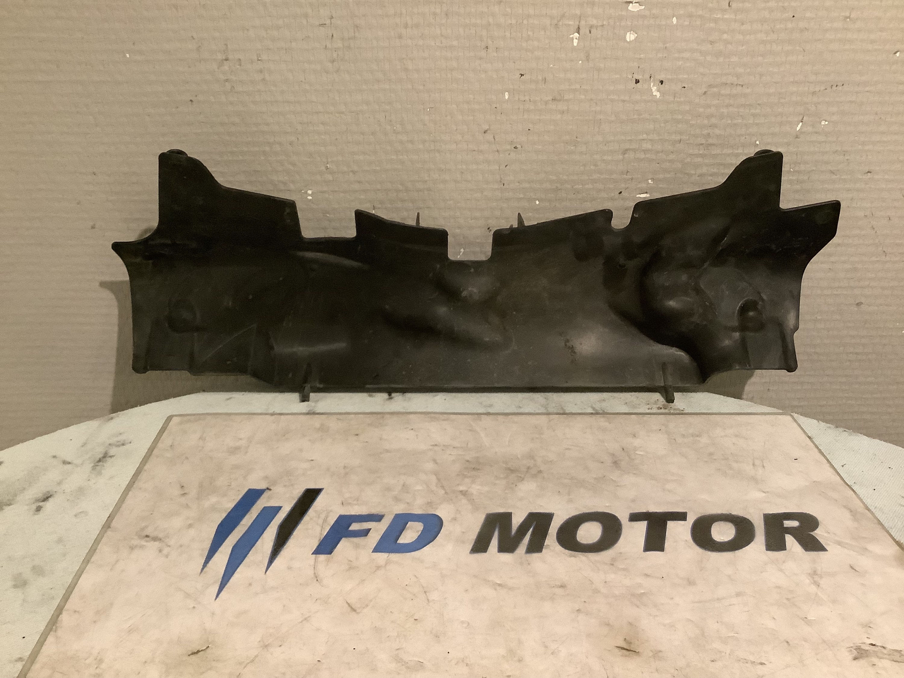 Protection au dessus du radiateur