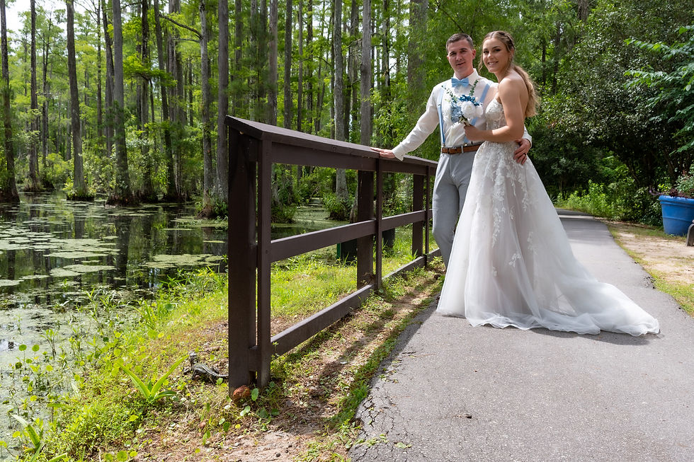 baby gator with bride and groom at cypress gardens