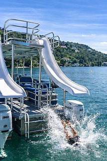 Double decker party boat with two water slides on Lake Austin