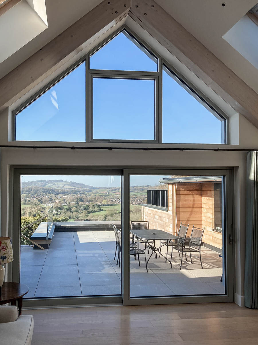 Perrymill new build Passivhaus. Monmouthshire. Lift and slide door with automated opening window above