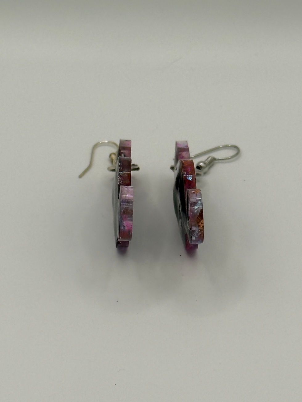 Thumbnail: Side view of handmade resin cat earrings showing thick layered resin with colorful foil inclusions