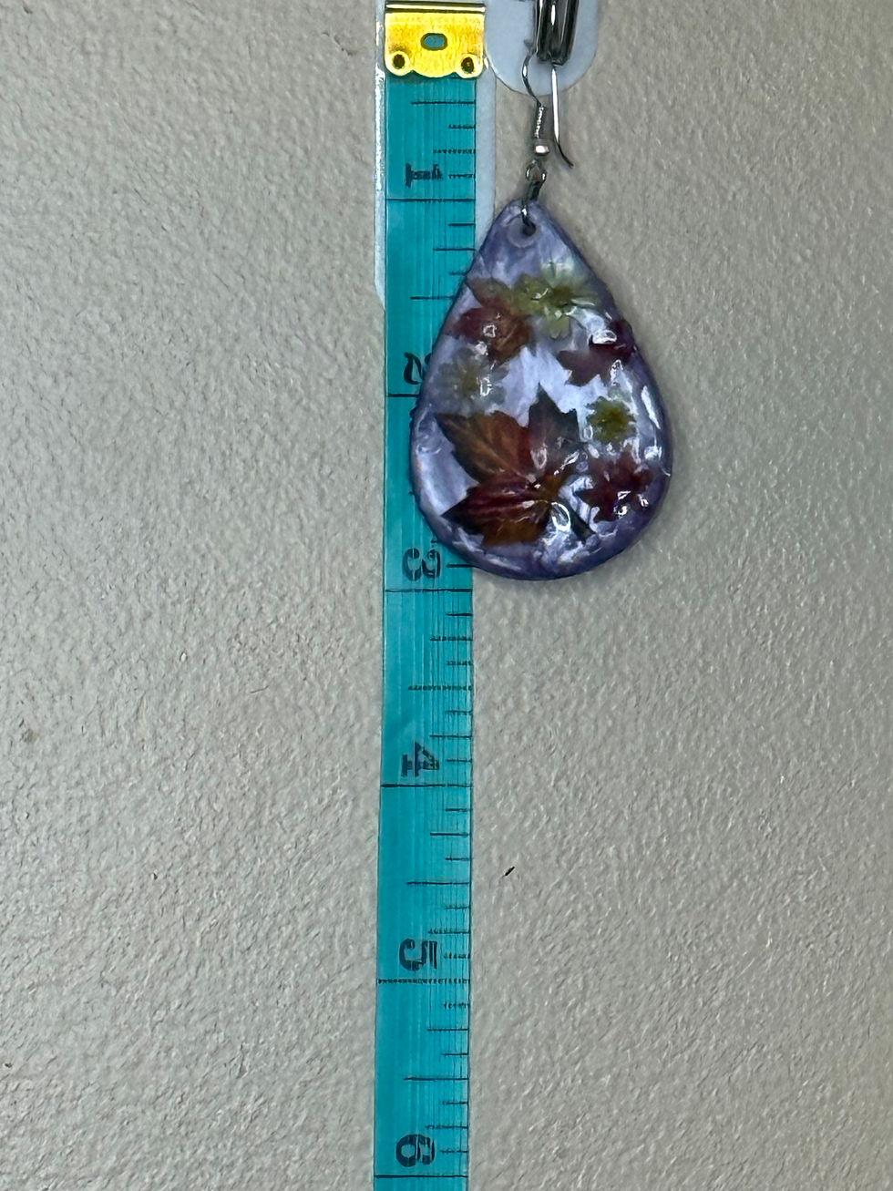 Thumbnail: Resin earring next to ruler showing size and length