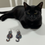 Thumbnail: Handmade resin earring next to a black cat for gift inspiration