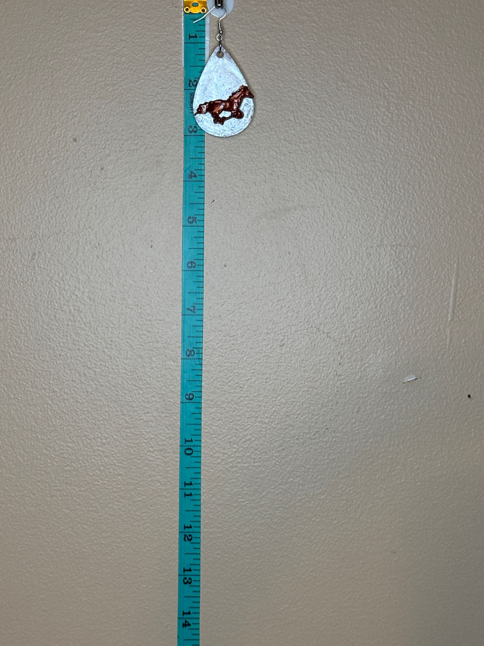 Thumbnail: Western horse earring shown next to ruler measuring about 1¼ inches long