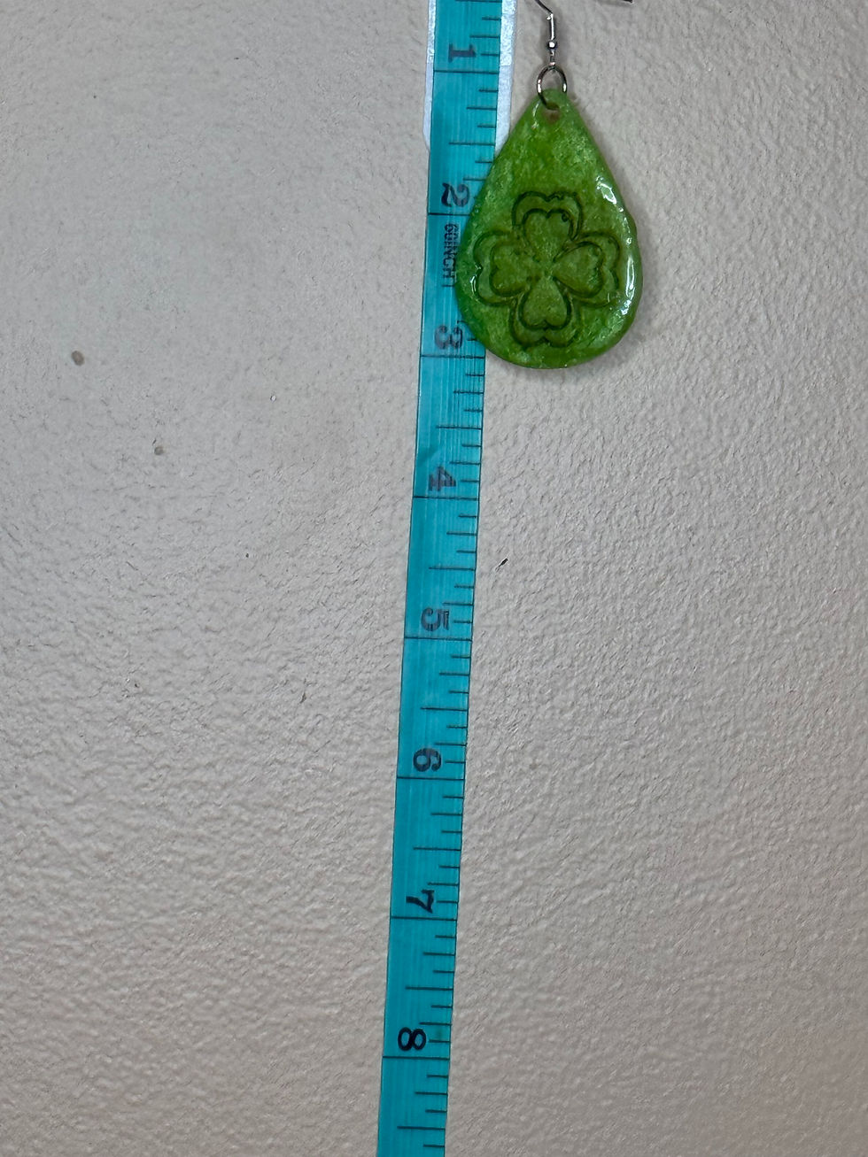 Thumbnail: ruler shot, earring starts at about the 2" mark and ends just past 3" — so approximately 1.5 inches tall