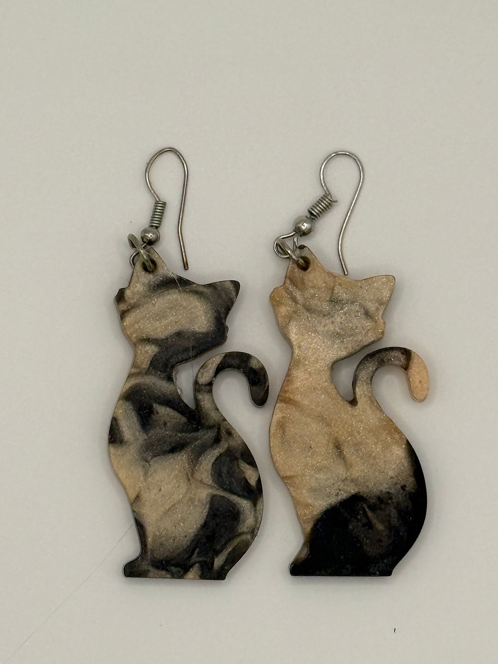 Thumbnail: Back view of handmade resin cat silhouette earrings with smooth finished backing