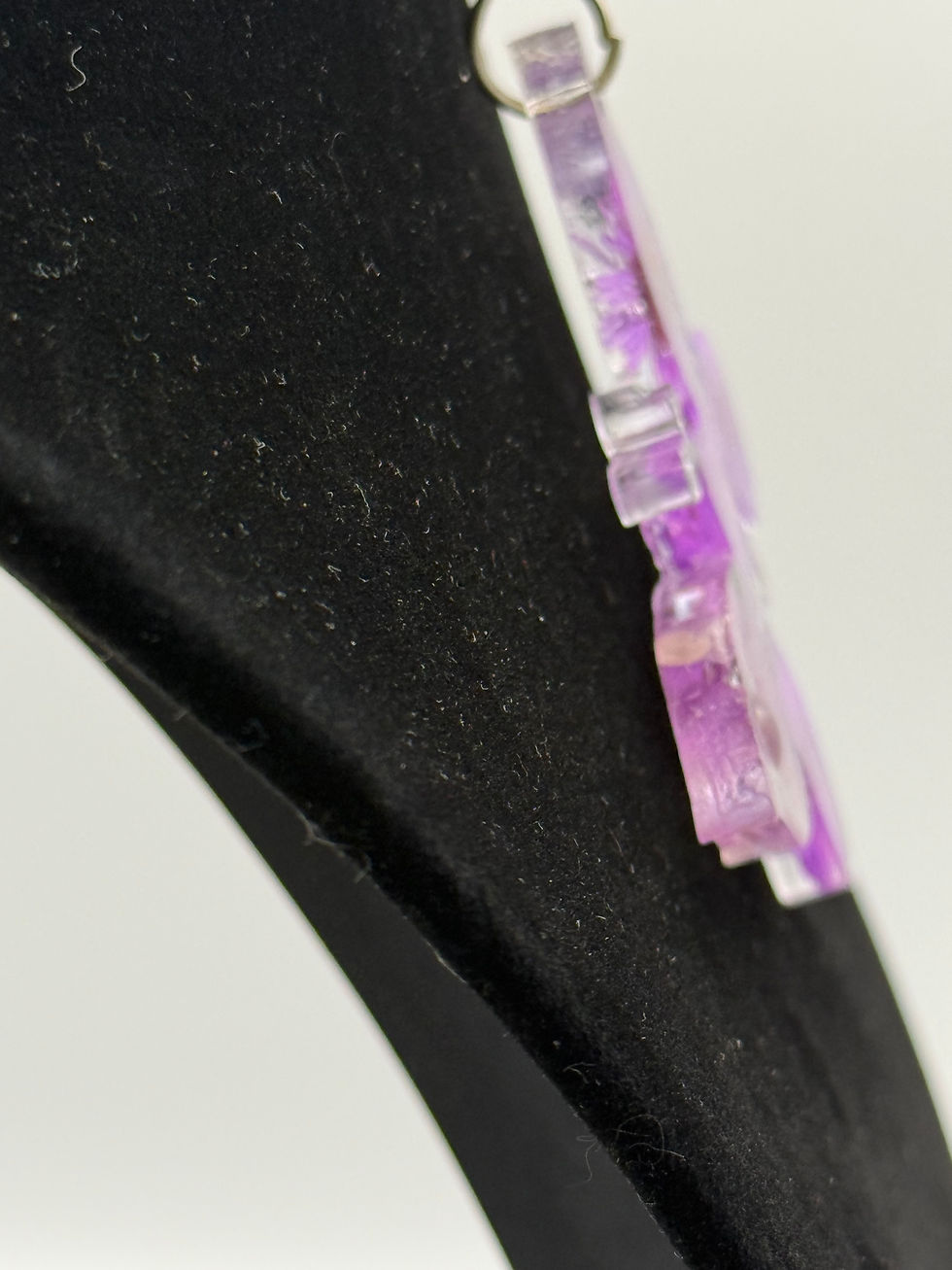 Thumbnail: Side view showing thickness and layered resin floral design