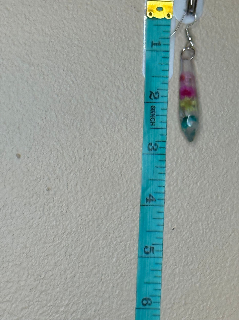 Thumbnail: Real flower resin crystal point earring shown beside ruler for size and scale reference