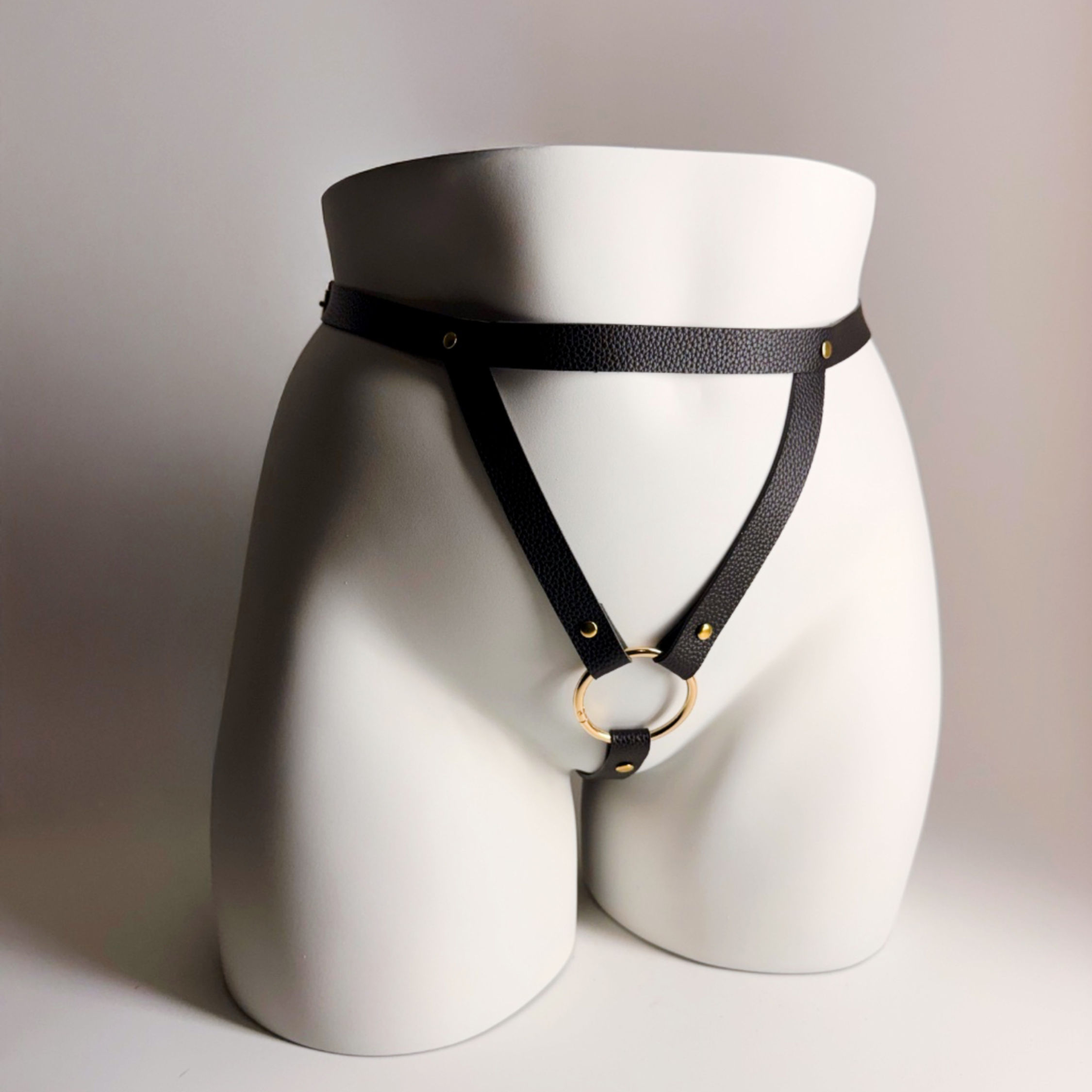 feminine strapon harness front view black adjustable strap design velvet nest