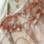 Velvet Nest Fleur Harness in blush ruffle cotton, feminine strap-on panty harness design.