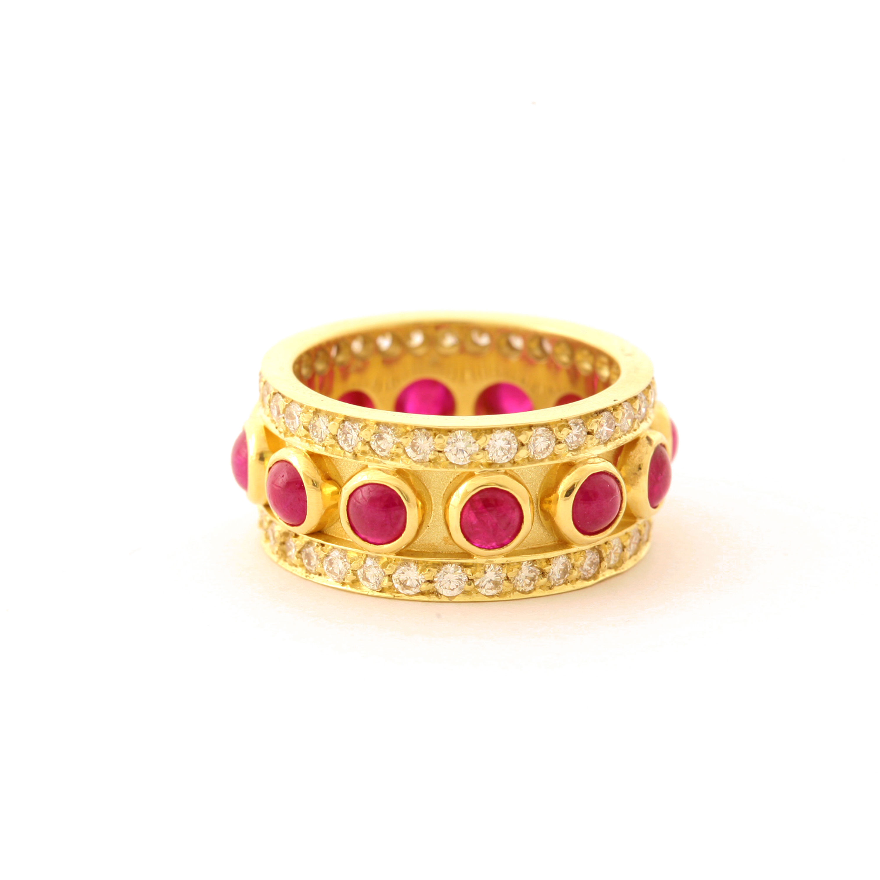 18k Band with Ruby Cabochons and 1.40 ctw G-H color, VS2 clarity Diamonds.