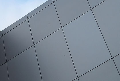 _The exterior wall of a contemporary commercial style building with aluminum metal composi